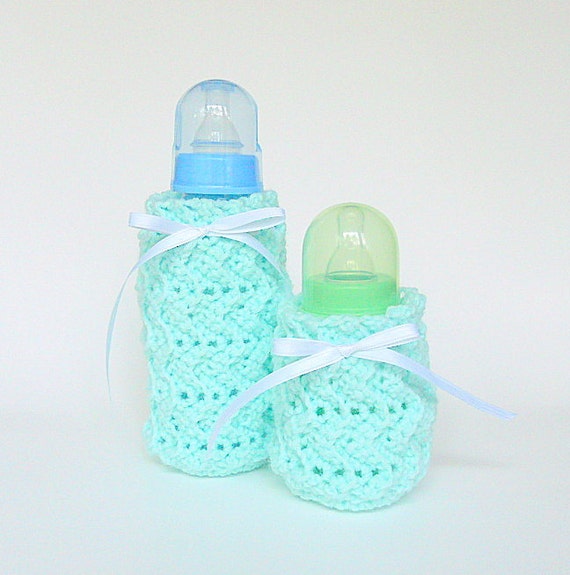 Two Pastel Green Baby Bottle Covers With White Ribbon Kozy