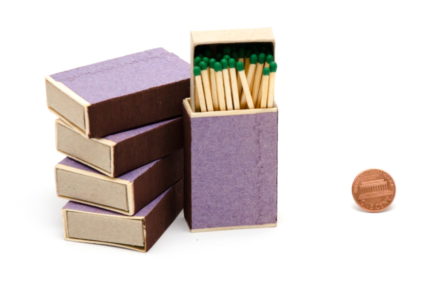 Five matchboxes wooden matches with emerald green heads