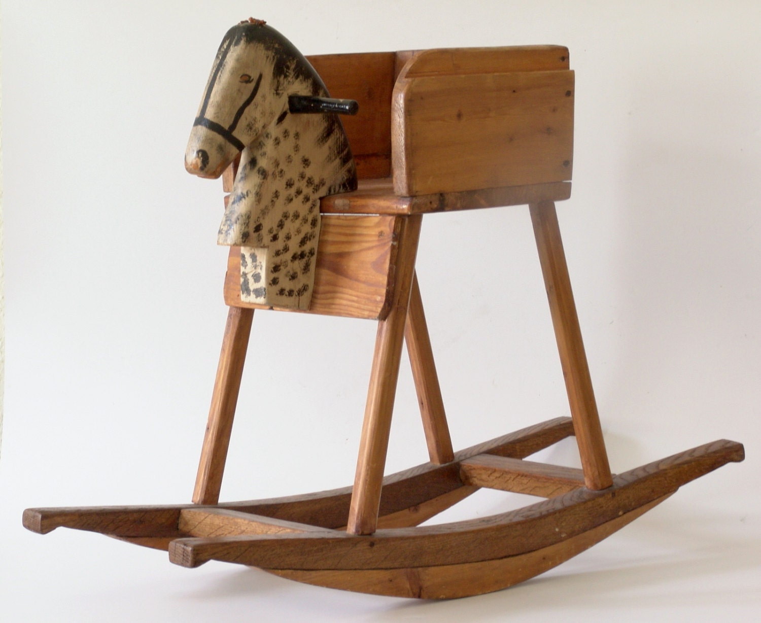 Unfinished wooden rocking horse