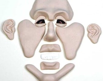 PF1 - Puzzle-Face Mold with Rugged Chin and Masculine Brow for creating clay faces by Maureen Carlson and Wee Folk Creations