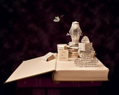 Postcard of the original book sculpture "Read it's escape"