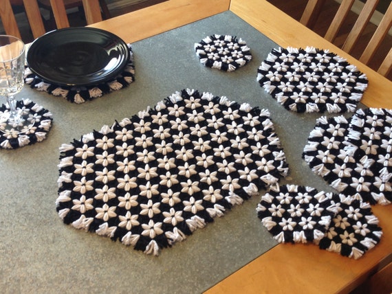 Full hand-loomed yarn table setting with white flowers and black accent!