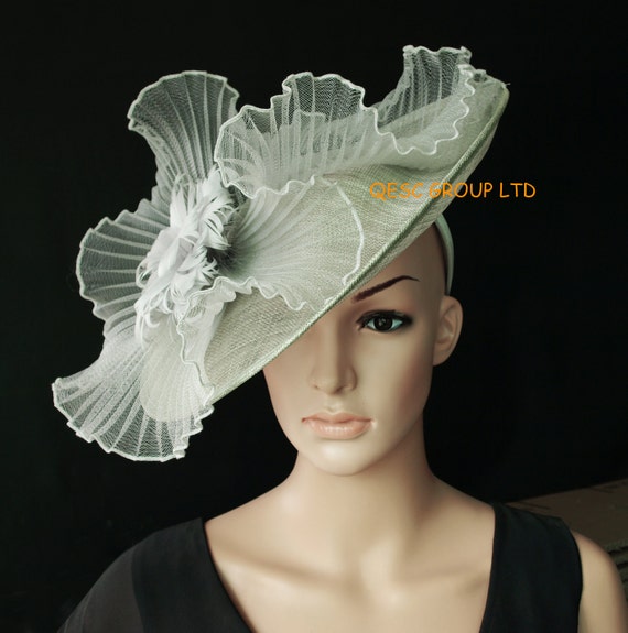 Items similar to Silver grey fascinator big sinamay saucer hat with