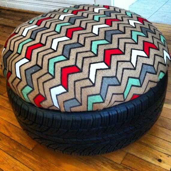 Unique handmade car tire ottoman with painted burlap cushion