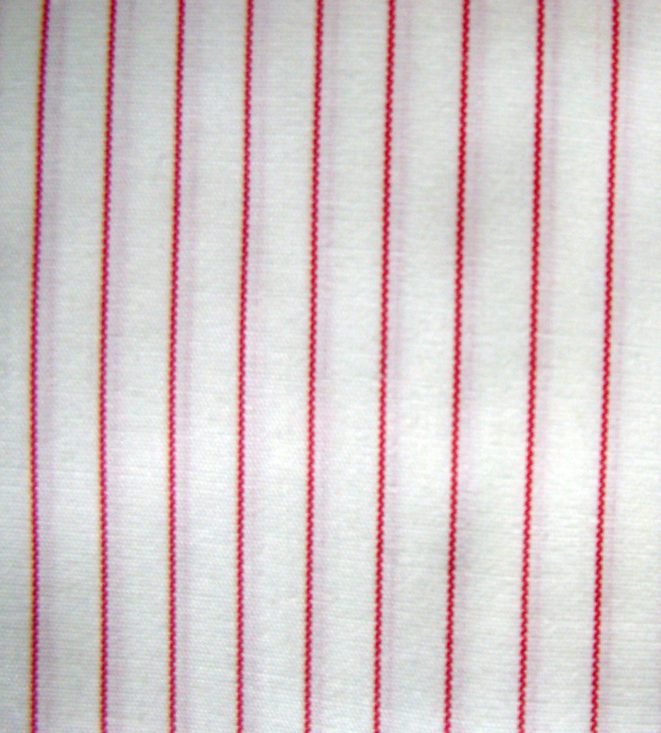 red and black pinstriped fabric