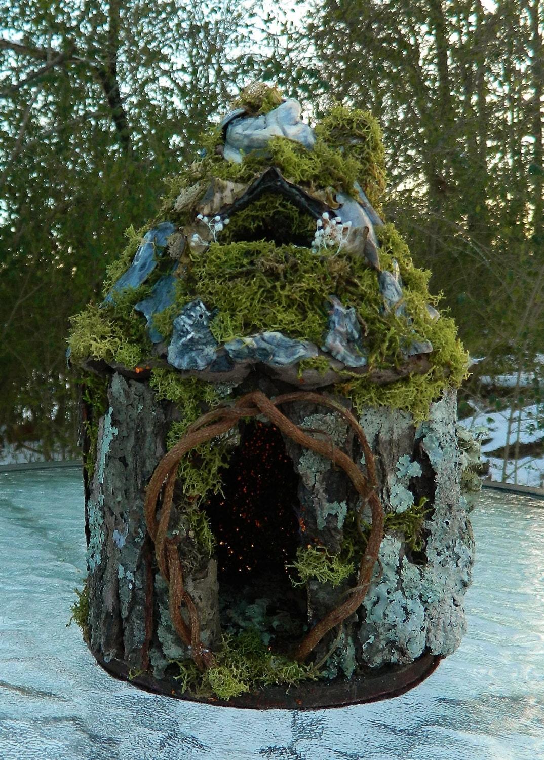 Hand crafted fairy house. Made with natural fauna. Stands 9