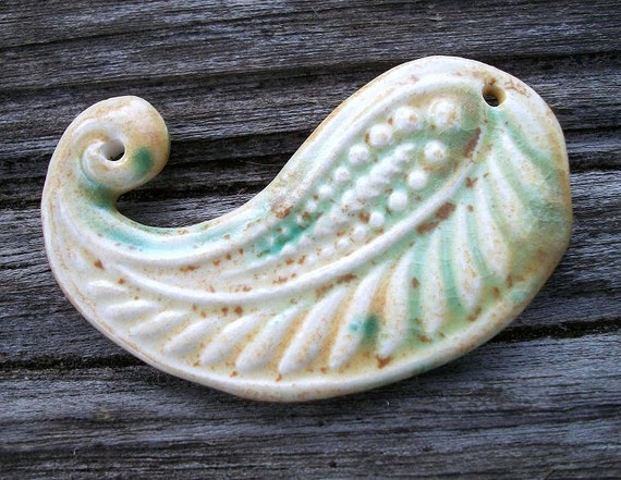 Handmade Ceramic Paisley Pendant in Shades of Beige and Green Bursts