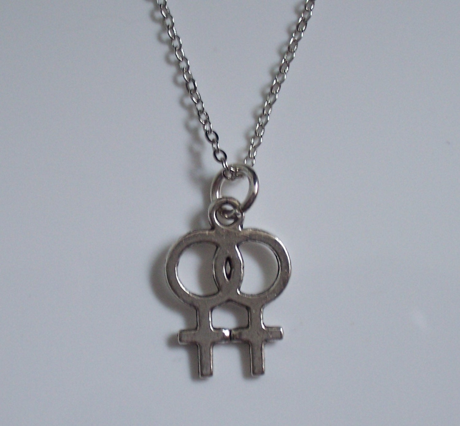 Silvertone double Venus symbol necklace lesbian woman