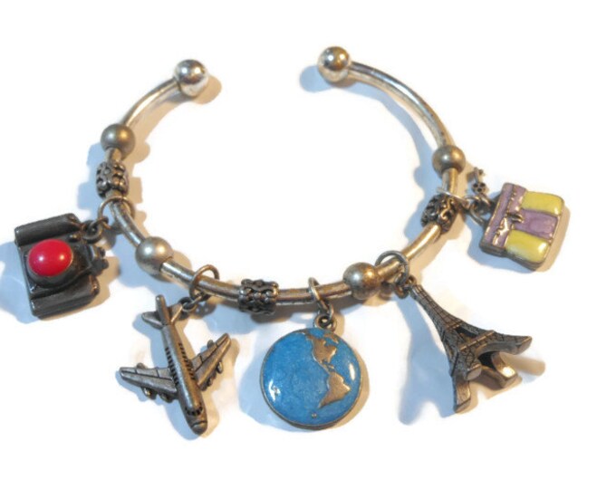 FREE SHIPPING Avon travel charm cuff bracelet marked nr silver plate with pewter charms - camera, plane, globe, Eiffel Tower, briefcase