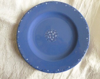 Decorative hand painted ceramic plate / blue with small flowers.