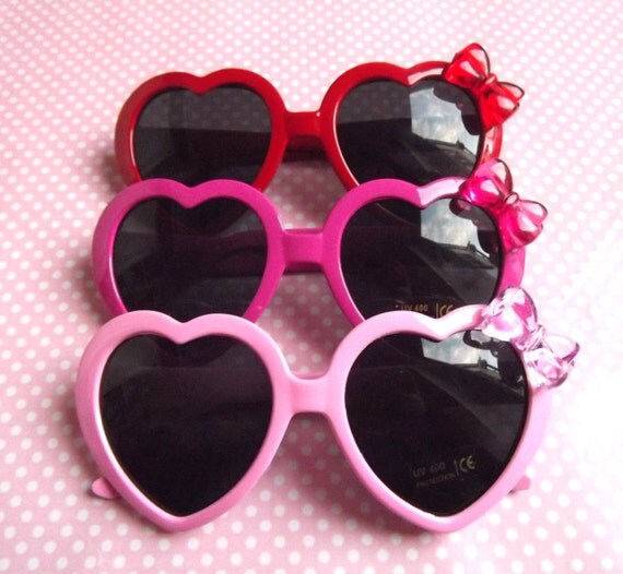 Cute heart shaped sunglasses in pastel pink, hot pink and red