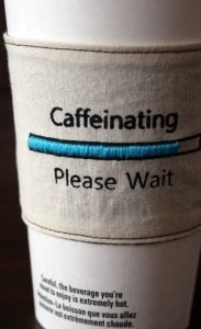 Caffeinating please wait cup cozy