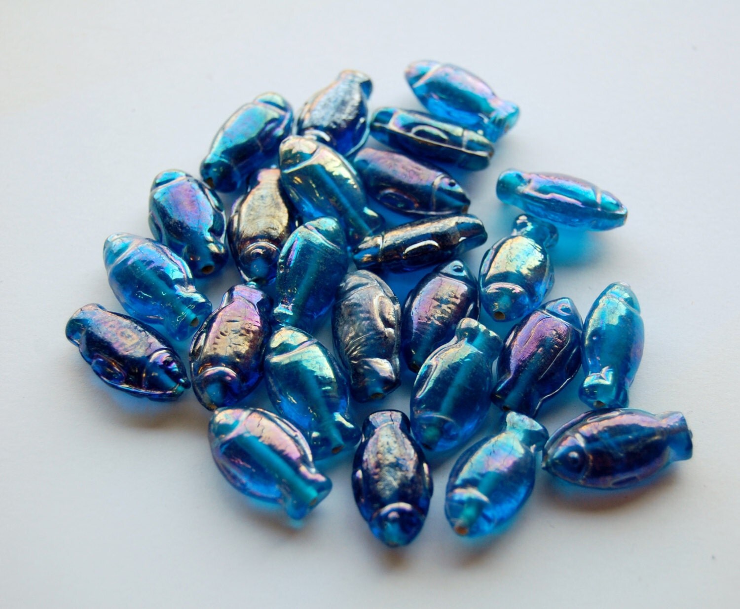 Iridescent blue glass beads fish shaped from India bulk
