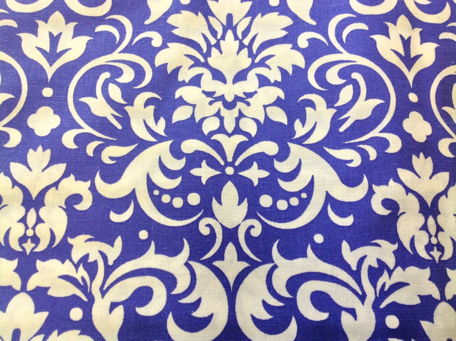Damask print fabric white on purple