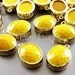 2 mustard yellow faceted oval glass in hammered bezel setting for jewelry making, glass beads 5074G-MU (bright gold, mustard, 2 pieces)