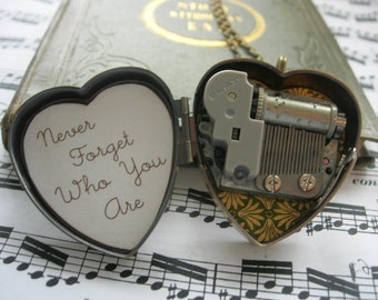 Little Wing tiny music box locket in green and gold