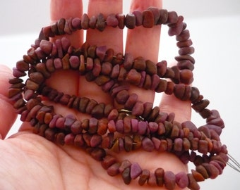 Rough rust ruby pebble/ nugget beads 4-8mm 1/2 strand