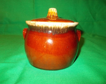 One (1), Individual Bean Pot, with Lid, from Hull China, in the Brown Drip Pattern.