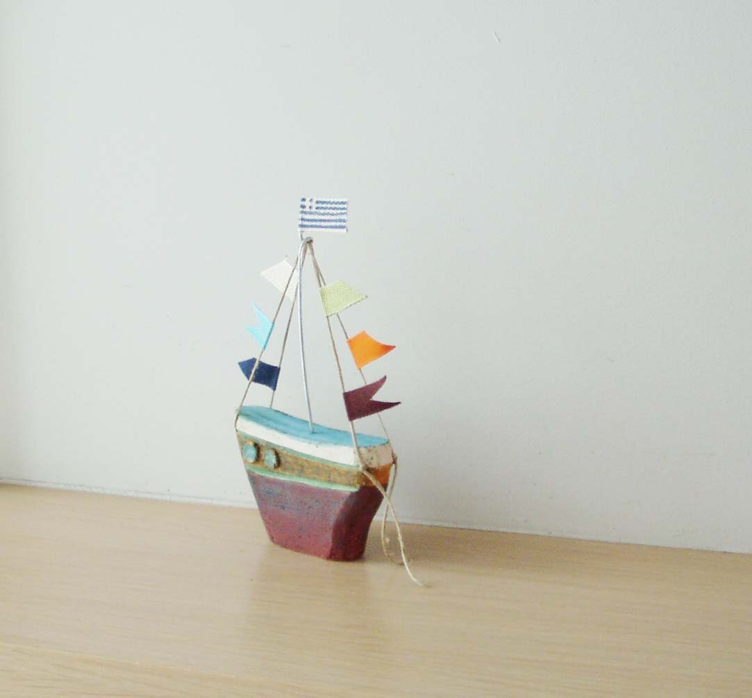 Ceramic sailing boat with colourful flags stoneware clay boat