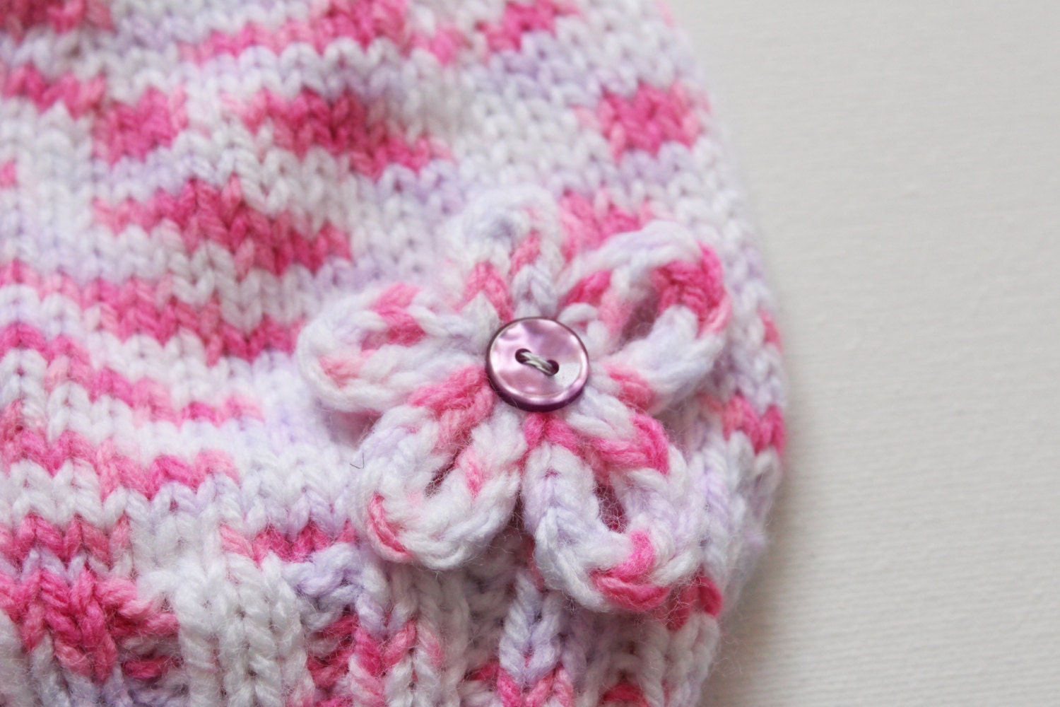 Pink flower baby hat newborn hat with a small flower on it