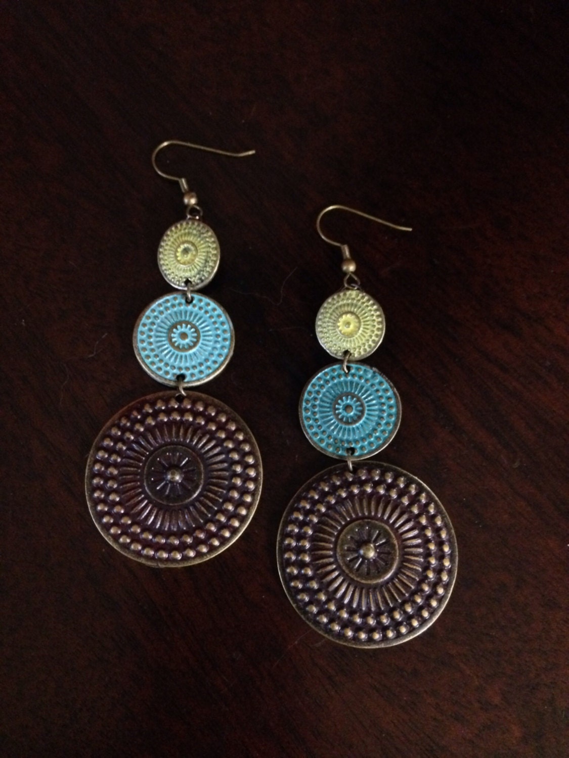 Three tiered dangle earrings in antique brass turquoise and