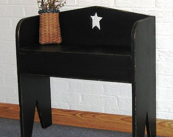 Small colonial, primitive black boot bench.
