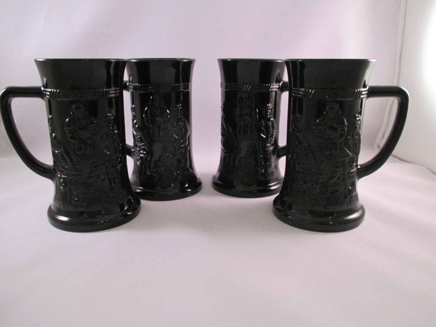 Vintage black glass beer steins set of 4 by Cricketsvintage