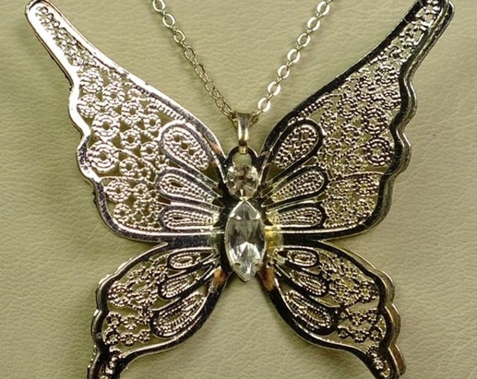 Storewide 25% Off SALE Vintage Butterfly Pendant Necklace that features intricate open work dimensional design