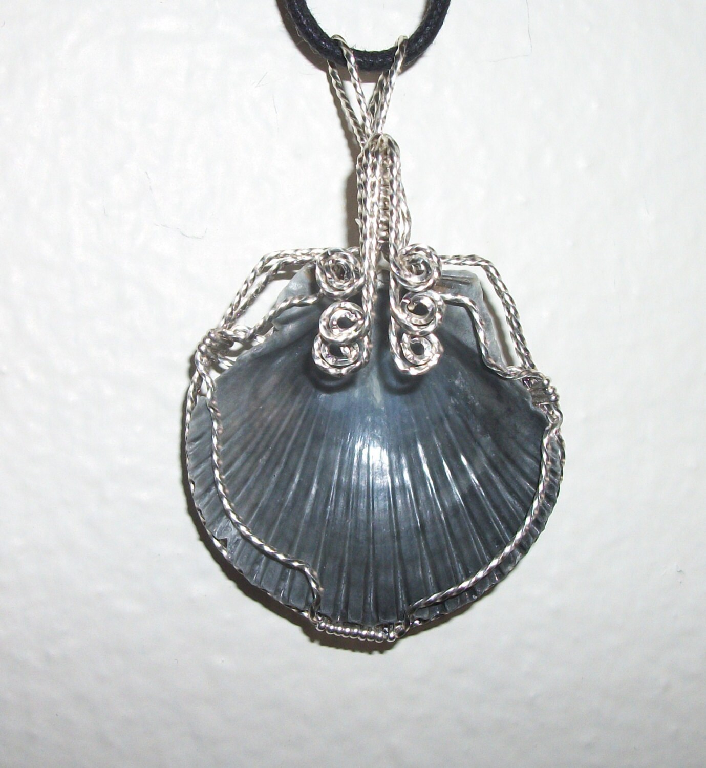 Natural Sea Shell Pendant wire wrapped in silver filled wire.