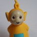 yellow teletubby toy