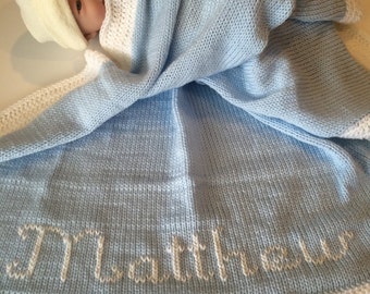 Personalized knitted baby blanket with crocheted edging. See color options available. Baby's first name monogrammed for free.