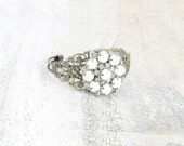 Vintage earring cuff bracelet . Recycled jewelry.  White glass flower.  One of a kind.