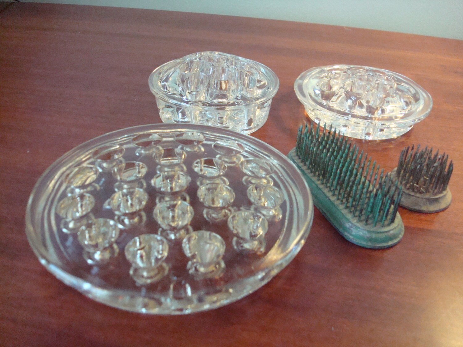 Set of THREE clear glass flower frogs plus two small green