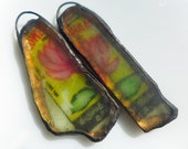 Flower beach glass charm pair with solder and ephemera.
