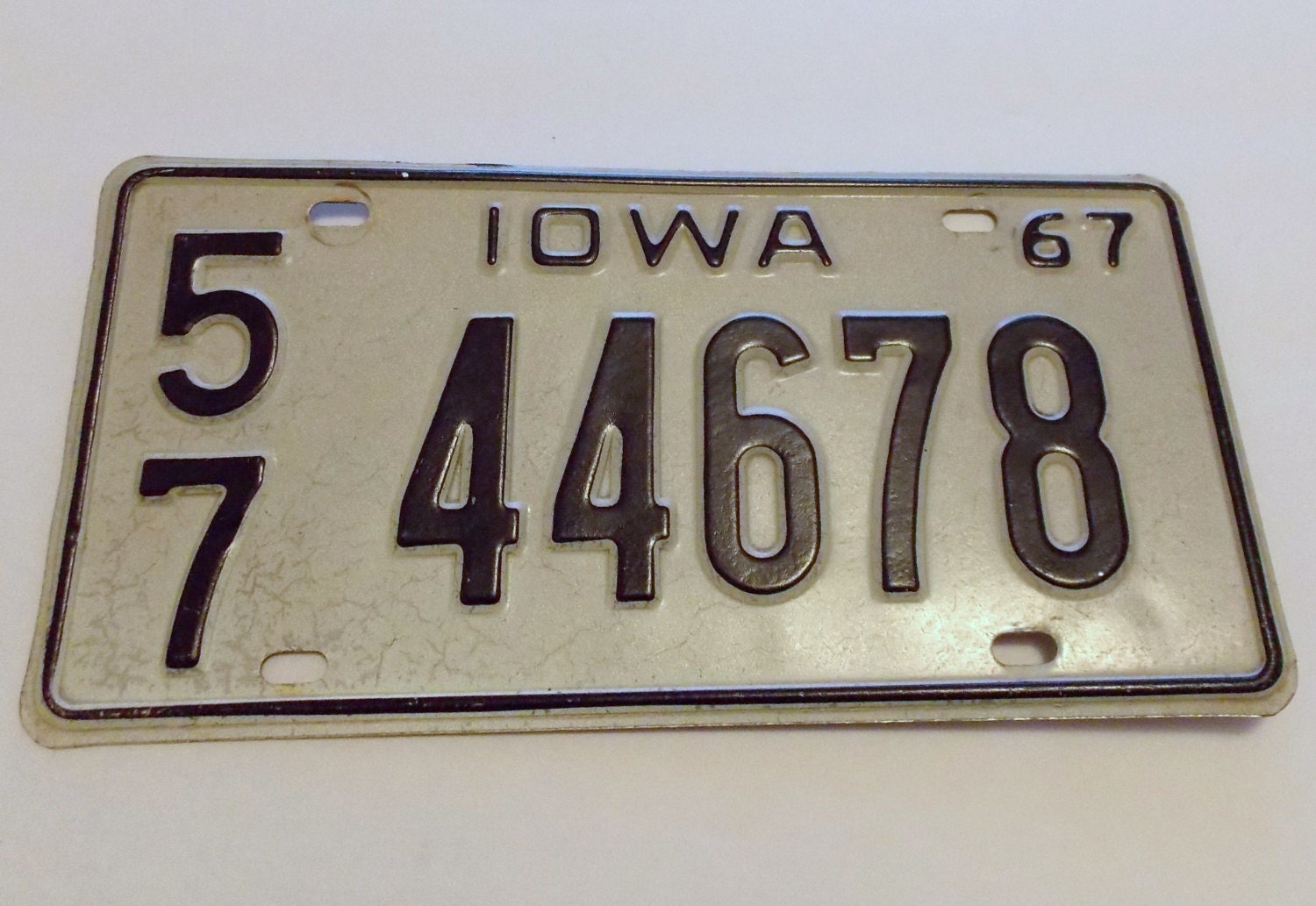 iowa-1967-license-plate-white-and-black-old-distressed