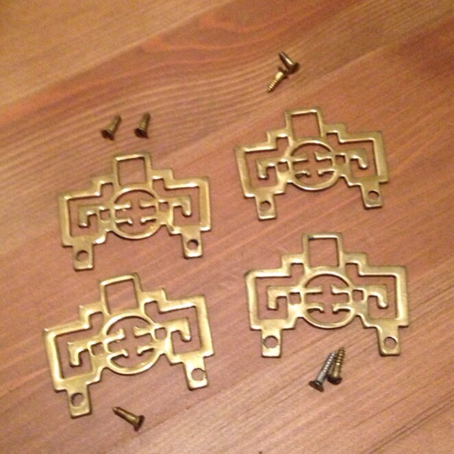 Add these brass asian hardware pieces to an old box trunk or