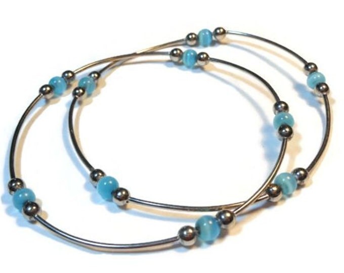 FREE SHIPPING Set of two silver plated bangles with light blue cat's eye glass beads vintage