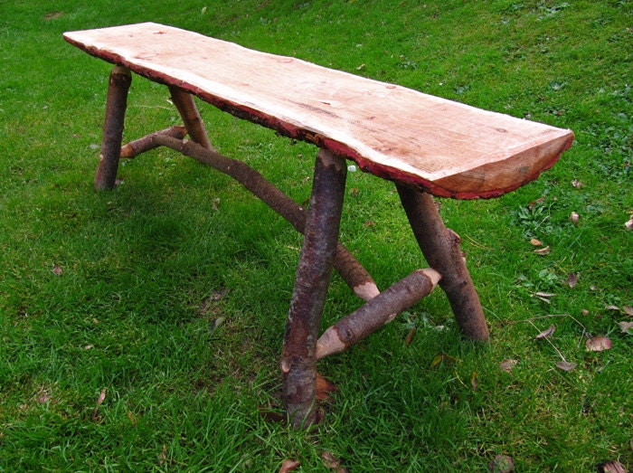 Rough rustic garden log bench out of mixed by SylvestrisCraftworks