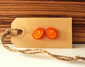 Orange earrings made of polymer clay, inspired by Lush' bubble bar The Brightside