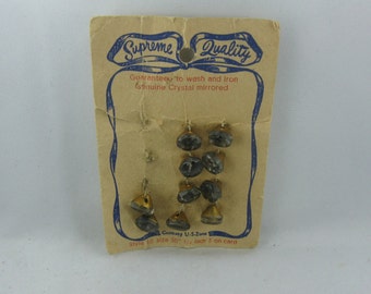 Supreme quality. 10 ancient GLASS buttons on original cardboard. Made in Germany US-Zone. Vintage