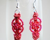Red hearts entwined micro macrame earrings.