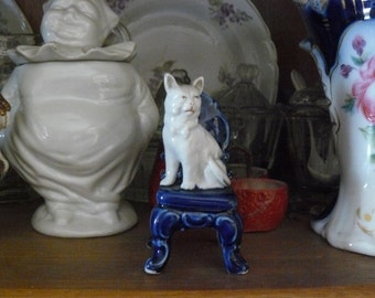 old miniature of 'cat sitting on a chair'