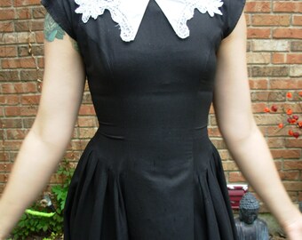 80's retro Wednesday Addams black dress with fitted bodice, full skirt, and white collar, size 6