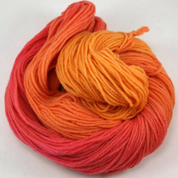 orange raspberry hand dyed variegated wool yarn 244 yd