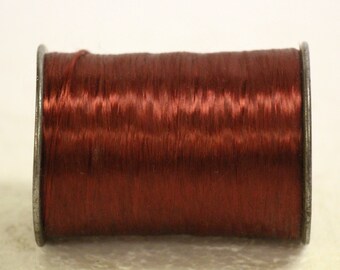 Large vintage spool Burgundy acetate fiber