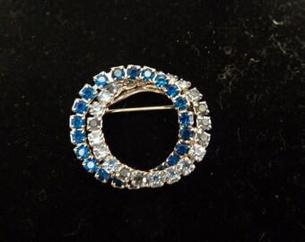 Classic double circle eternity pin with blue and clear stones
