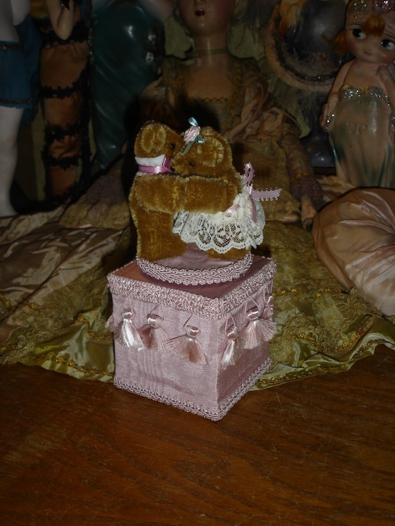 antique teddy bear with music box inside