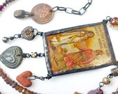 A Love Song. Assemblage art necklace with gemstones and matchbook label.