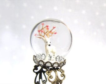 Woodland Terrarium Ring globe with white Deer in snow and red stars in his antlers.