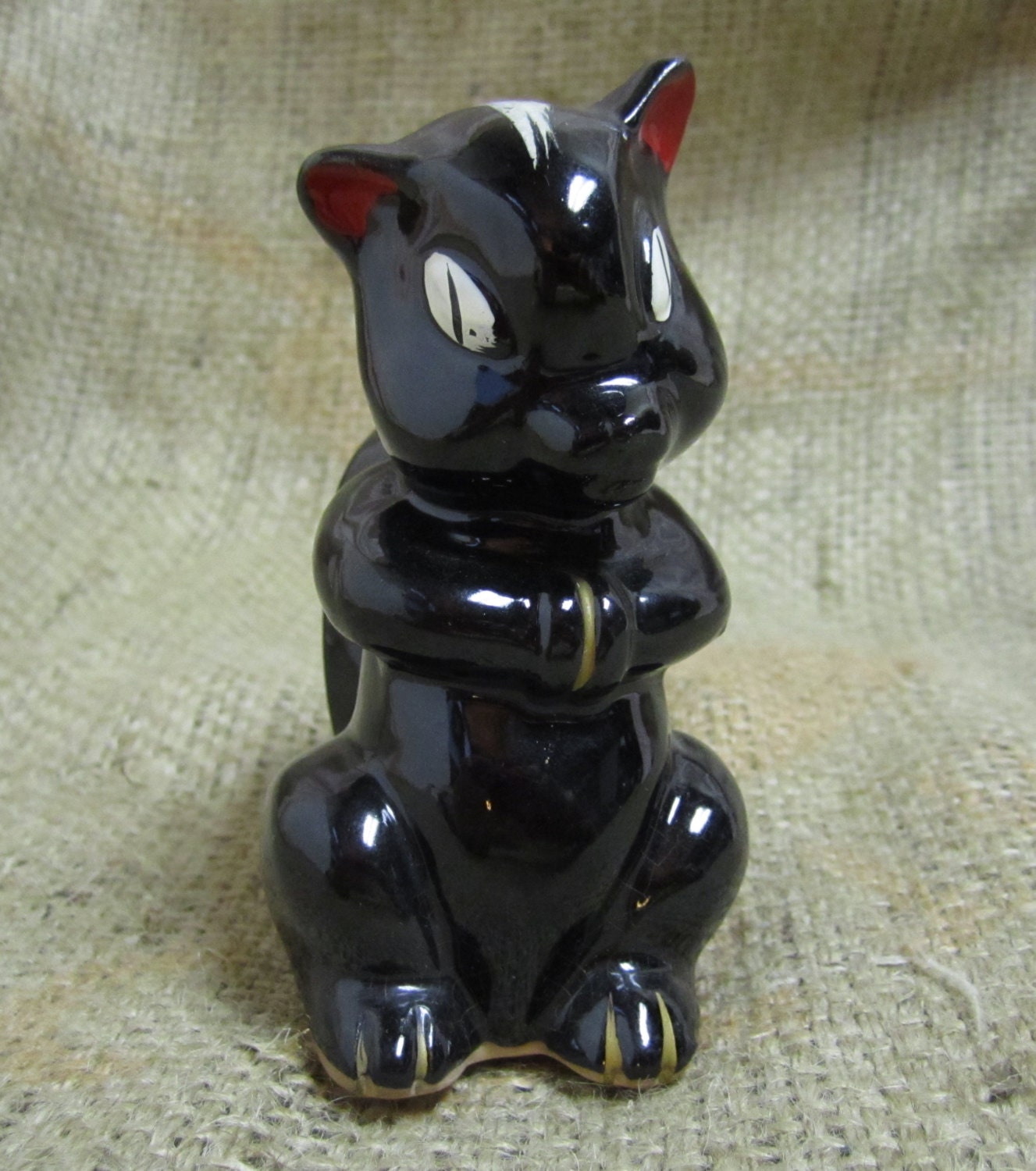 ceramic skunk figurines